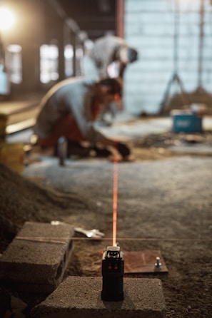 a man working on a piece of concrete