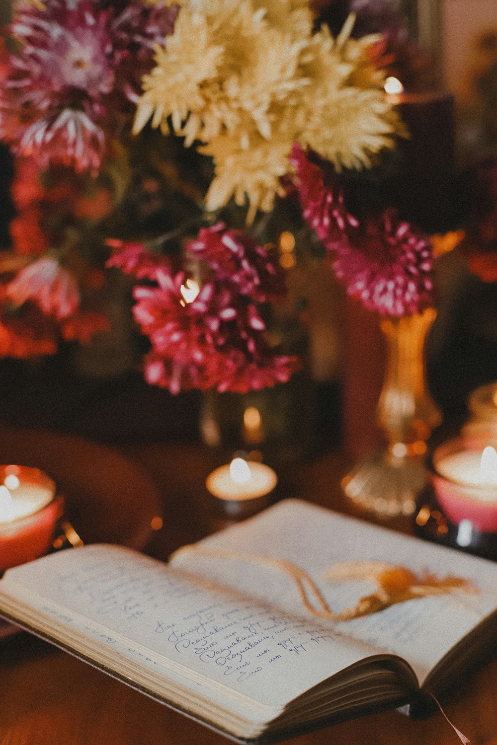 an open book sitting on top of a wooden table