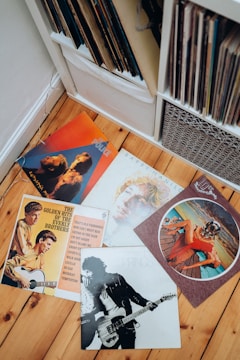 a collection of elvis presley memorabilia on a wooden floor