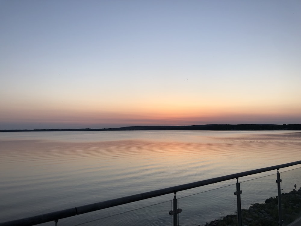 a view of a body of water at sunset