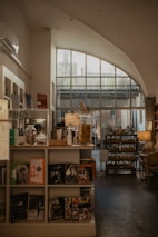 a room filled with lots of books and furniture