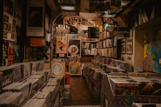 Cozy interior of a small local record shop filled with shelves of vinyl records.