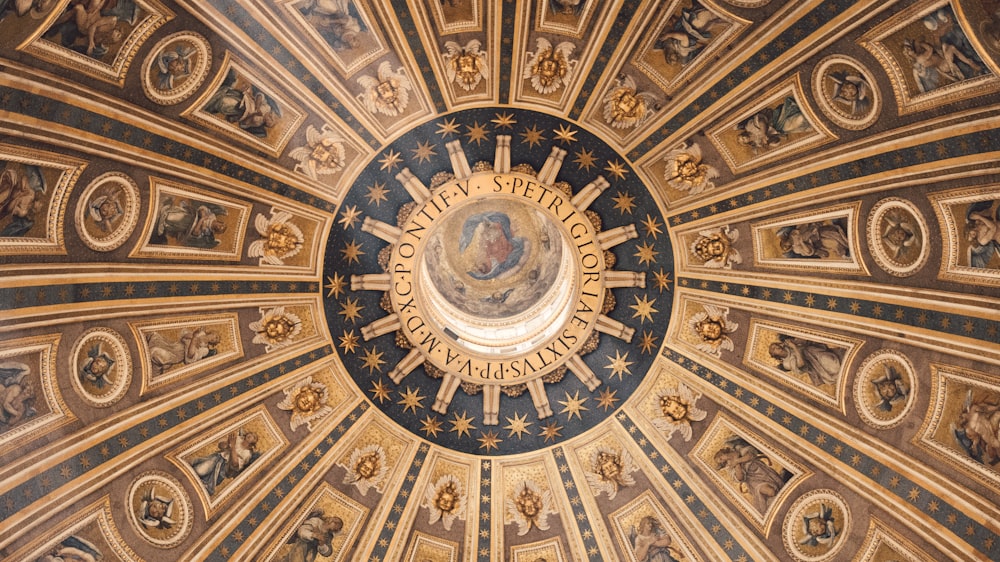 the ceiling of the dome of a building with paintings on it