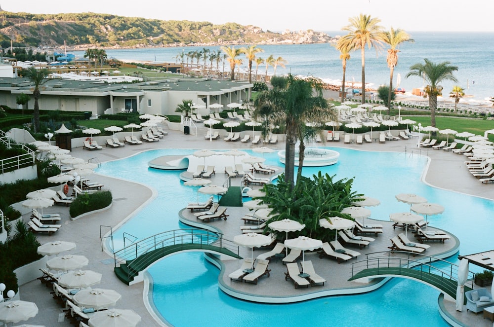 a large swimming pool next to a beach