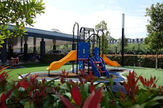 a children's play area with a slide and climbing frame