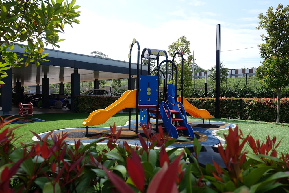 a children's play area with a slide and climbing frame