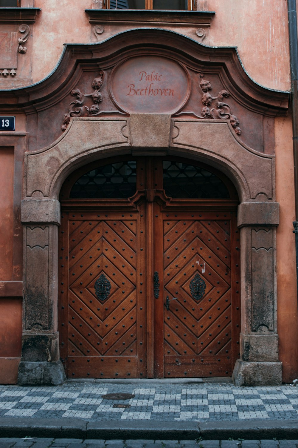a couple of large wooden doors in front of a building