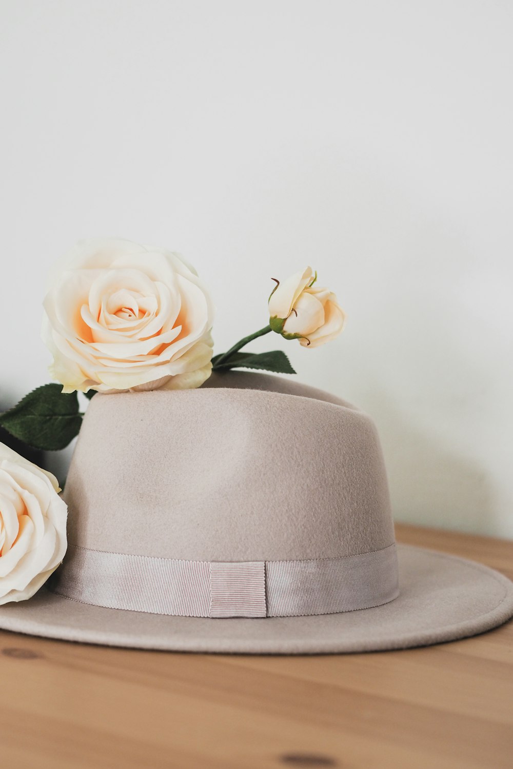 a hat with flowers on top of it