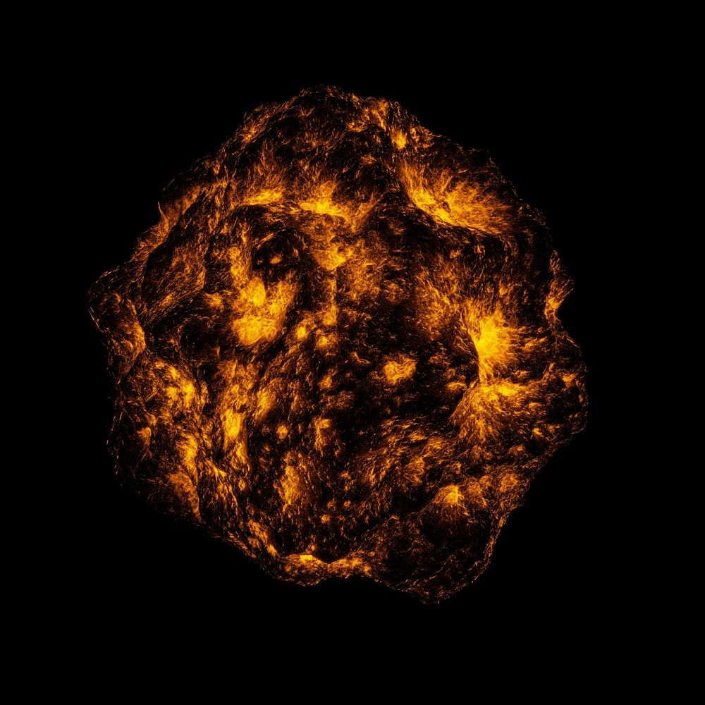 a close up of a sun object in the dark