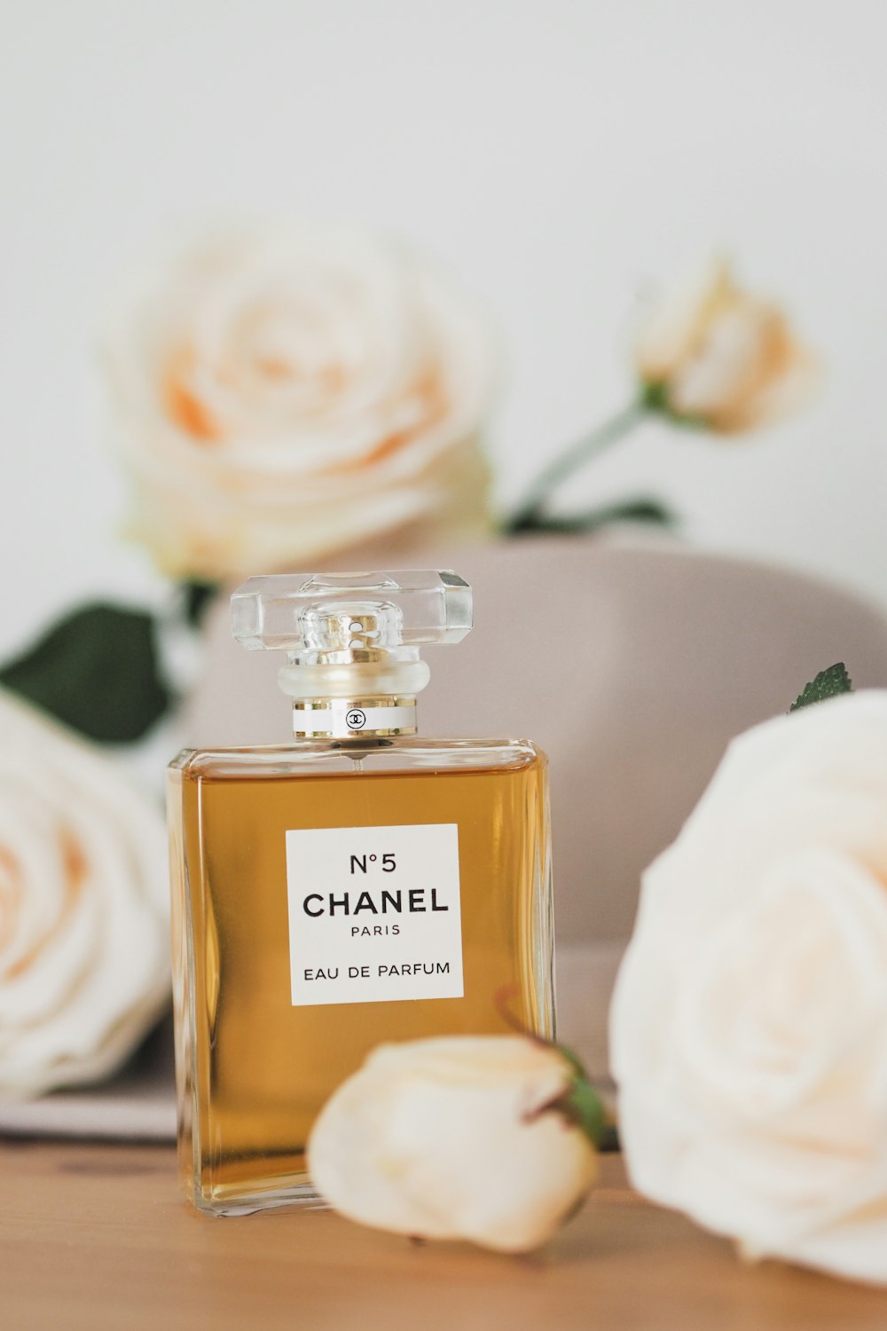 A bottle of chanel no 5 on a white surface photo – Free Texture Image on  Unsplash