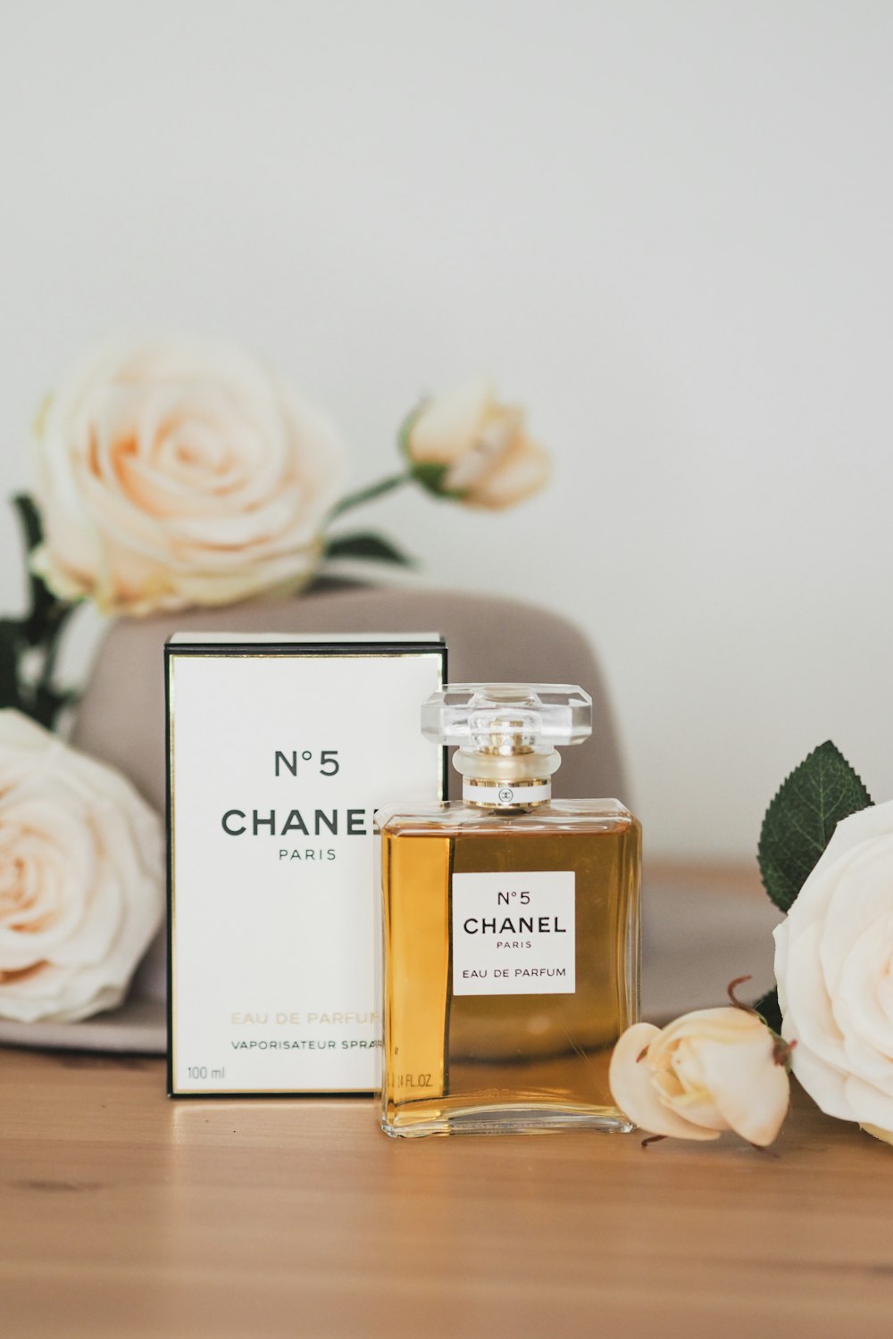 A bottle of chanel no 5 next to a box of perfume photo – Free Plant Image  on Unsplash