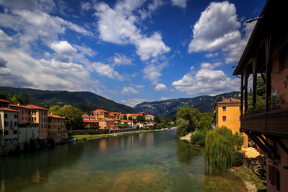 a river running through a lush green hillside