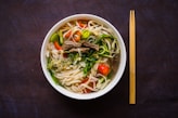 a bowl of Vietnamese noodle soup with chopsticks on the side UpBe Asian exporters Vietnamese food