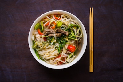 a bowl of Vietnamese noodle soup with chopsticks on the side UpBe Asian exporters Vietnamese food