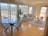 A modern glass furniture piece displayed in a stylish living room.
