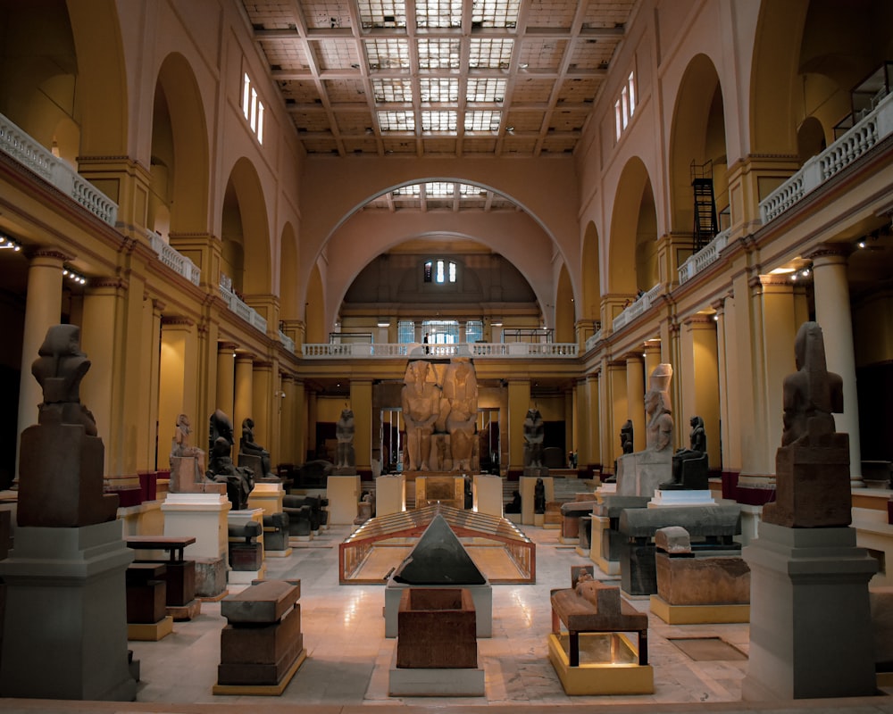 a large room with many statues in it