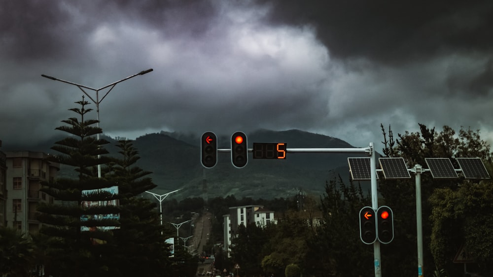 a couple of traffic lights sitting on the side of a road