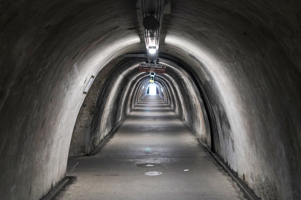 a long tunnel with a light at the end