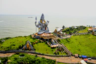 an aerial view of a large statue on a hill
