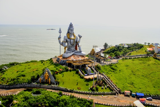 an aerial view of a large statue on a hill