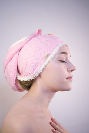 a woman with a towel wrapped around her head