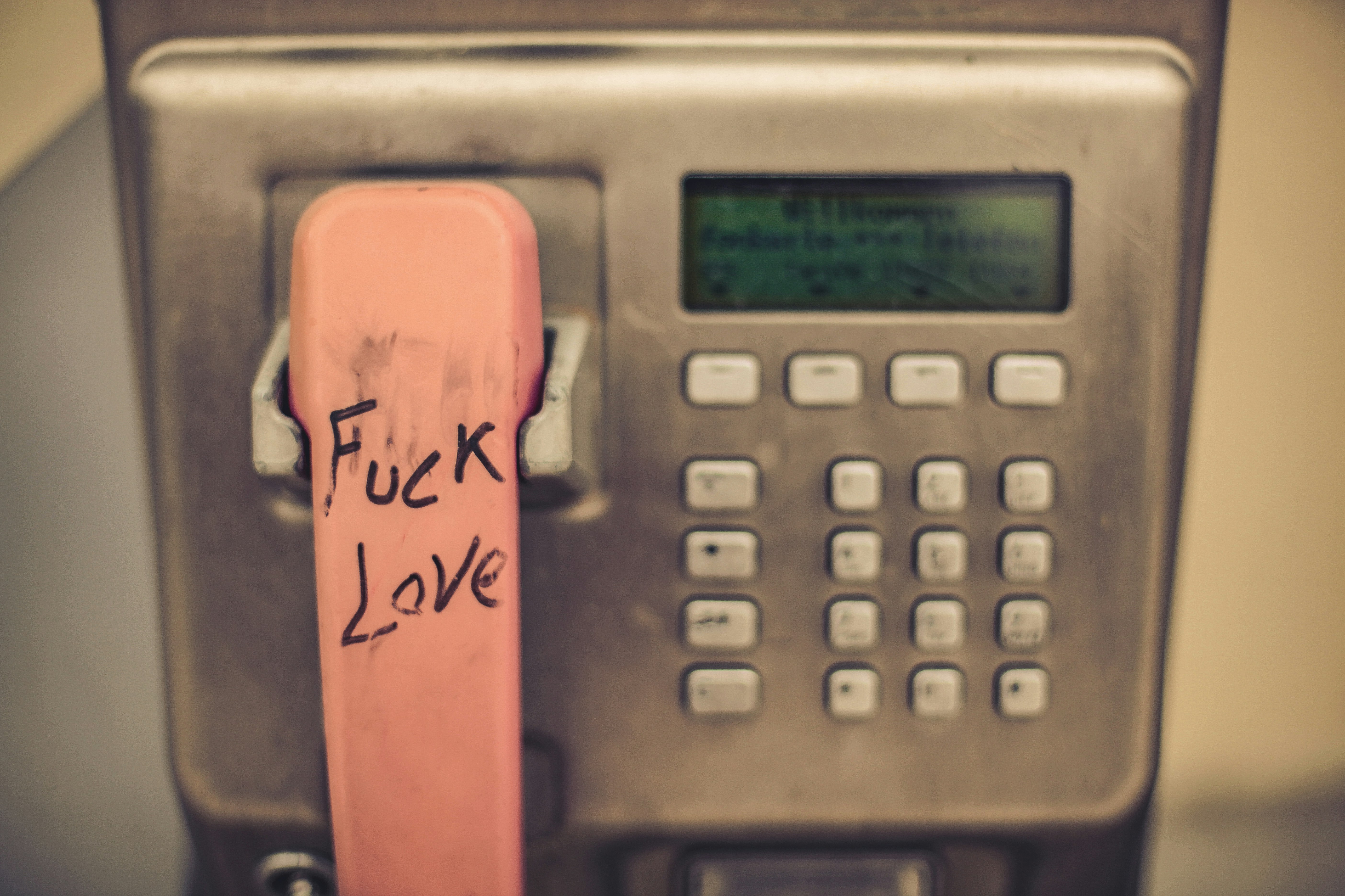 a phone with a pink sticker on the back of it