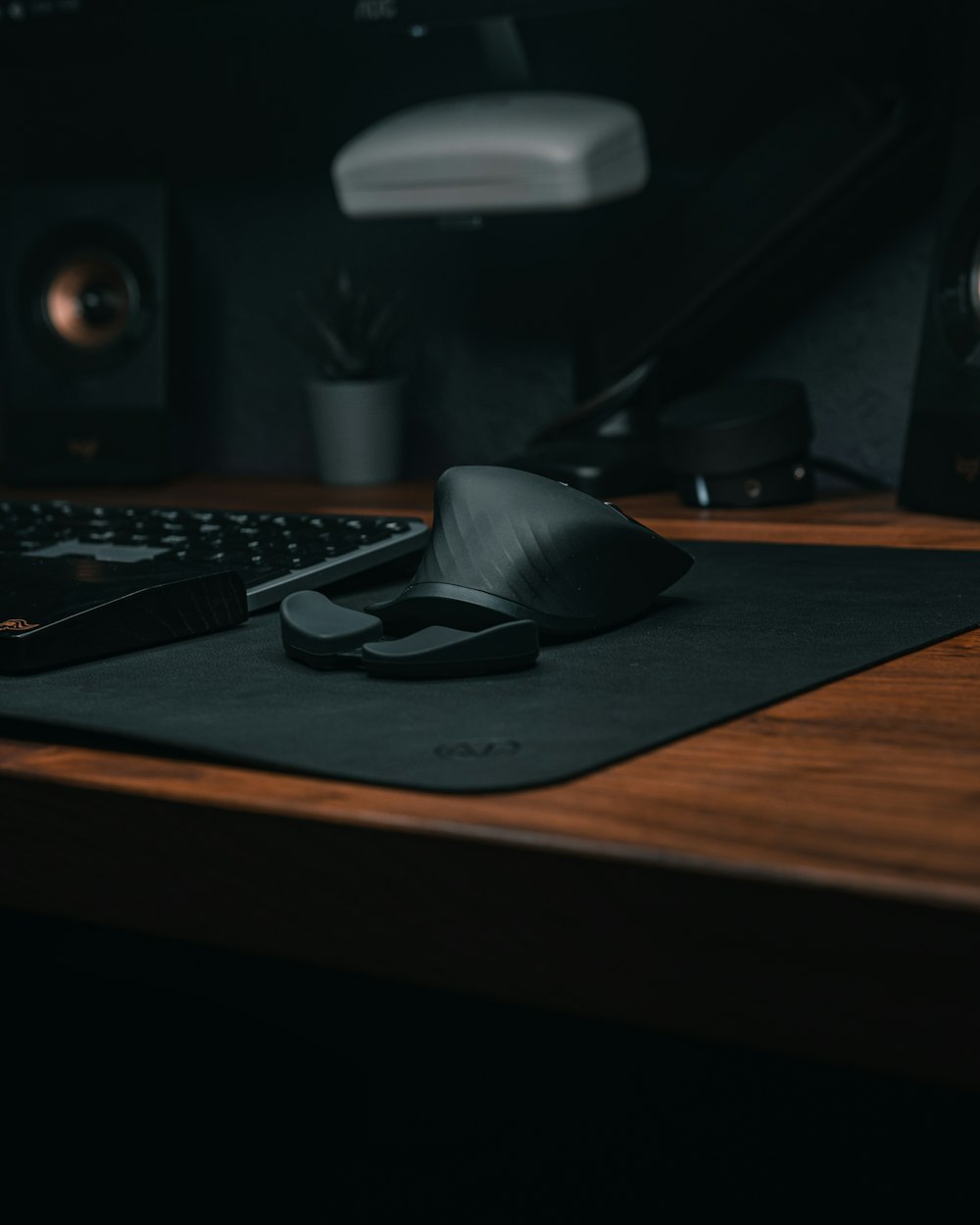 a computer mouse and keyboard on a desk