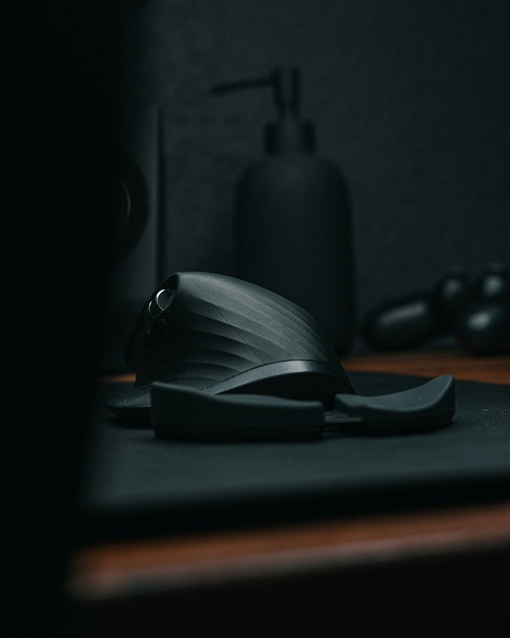 a computer mouse sitting on top of a wooden desk