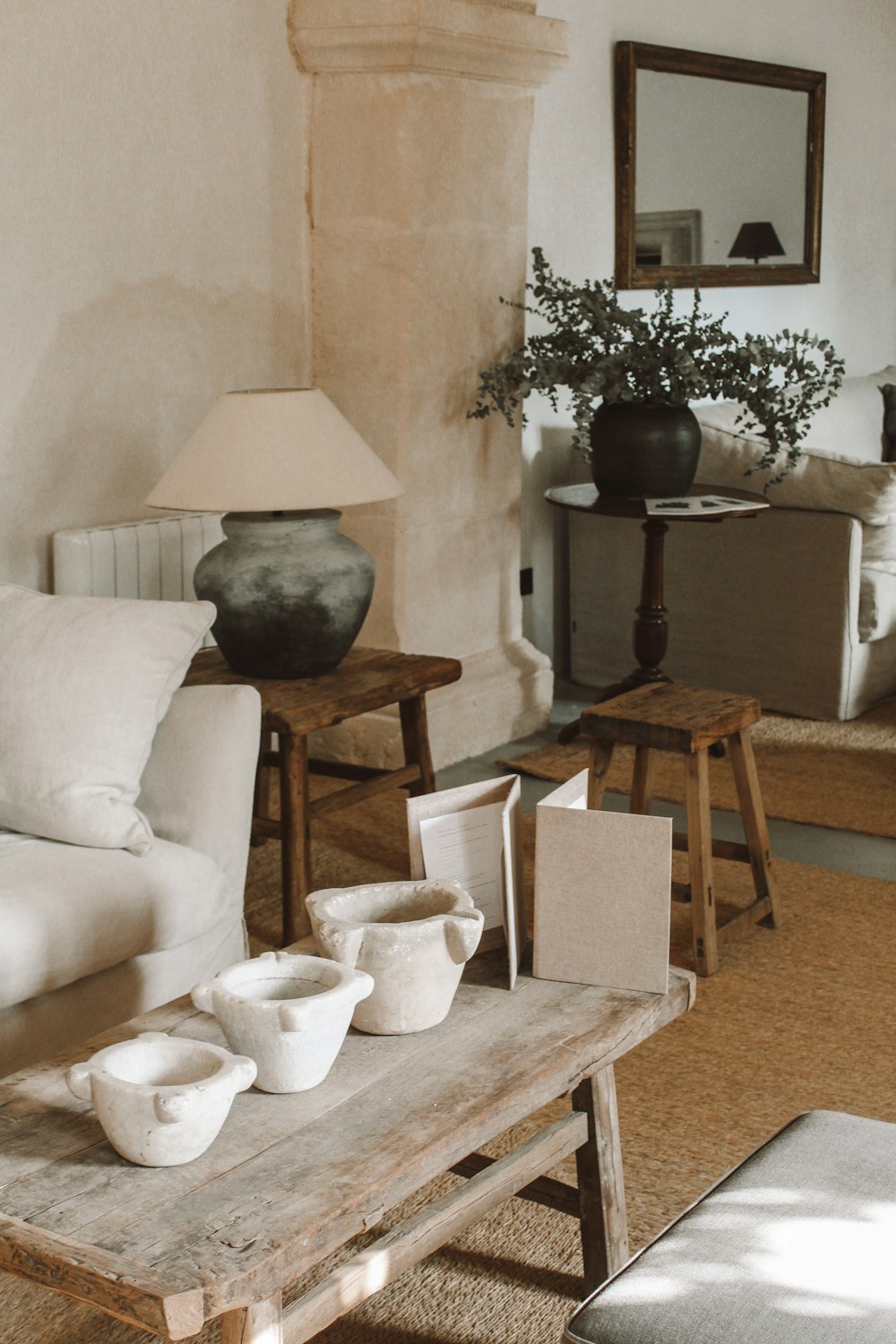 a living room filled with furniture and a lamp