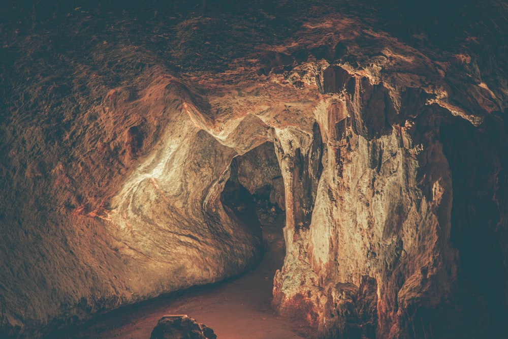 a cave filled with lots of rocks and water