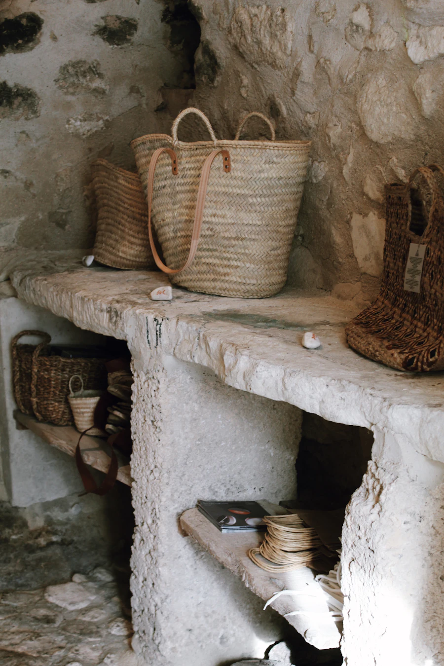 Shelves styled with woven baskets for hidden storage