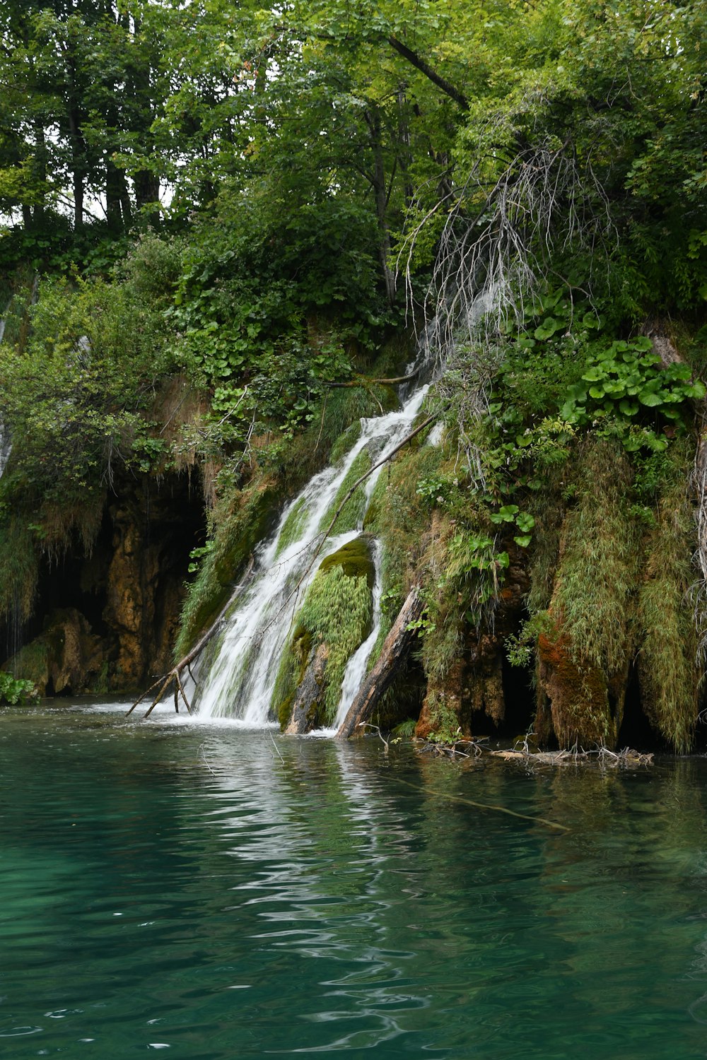 a large waterfall is coming out of the water