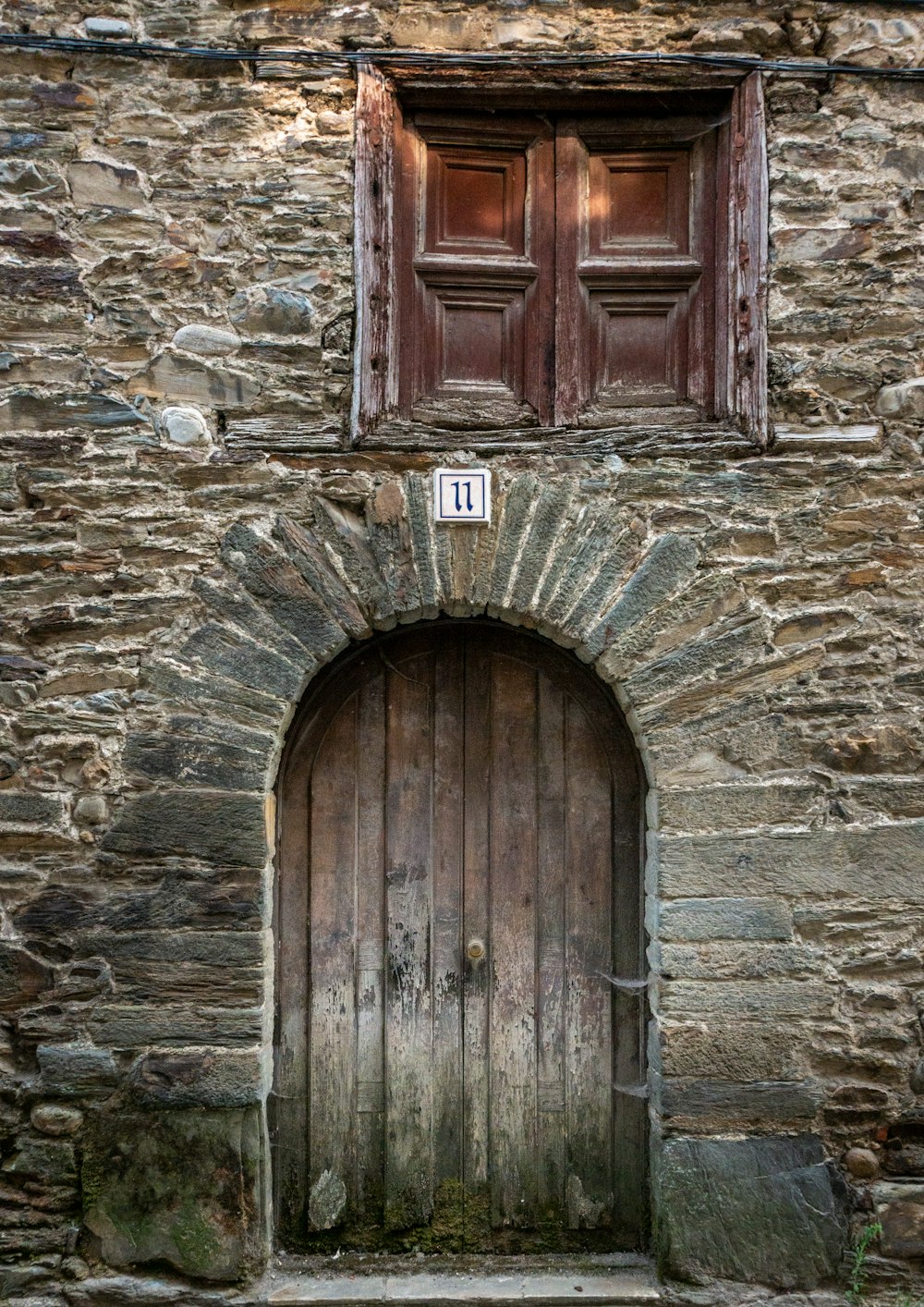 a wooden door with a sign on it