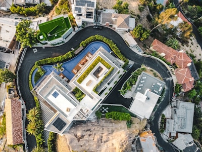 an aerial view of a house with a swimming pool