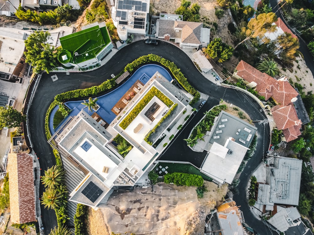 an aerial view of a house with a swimming pool