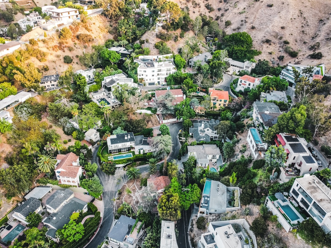 an aerial view of a residential neighborhood in the hills, Hollywood Hills Drone sunrise drone shot. ©Ariel blanco