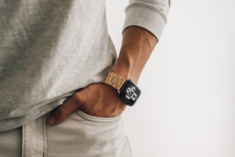 a person wearing a watch on their wrist