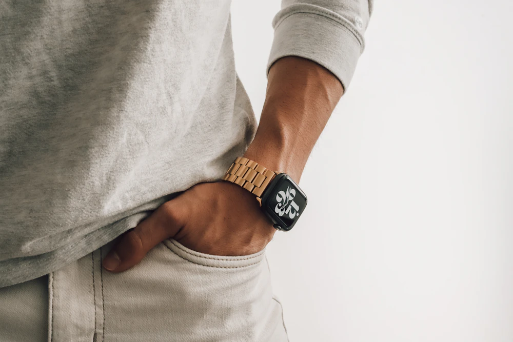 Gold watch worn on wrist