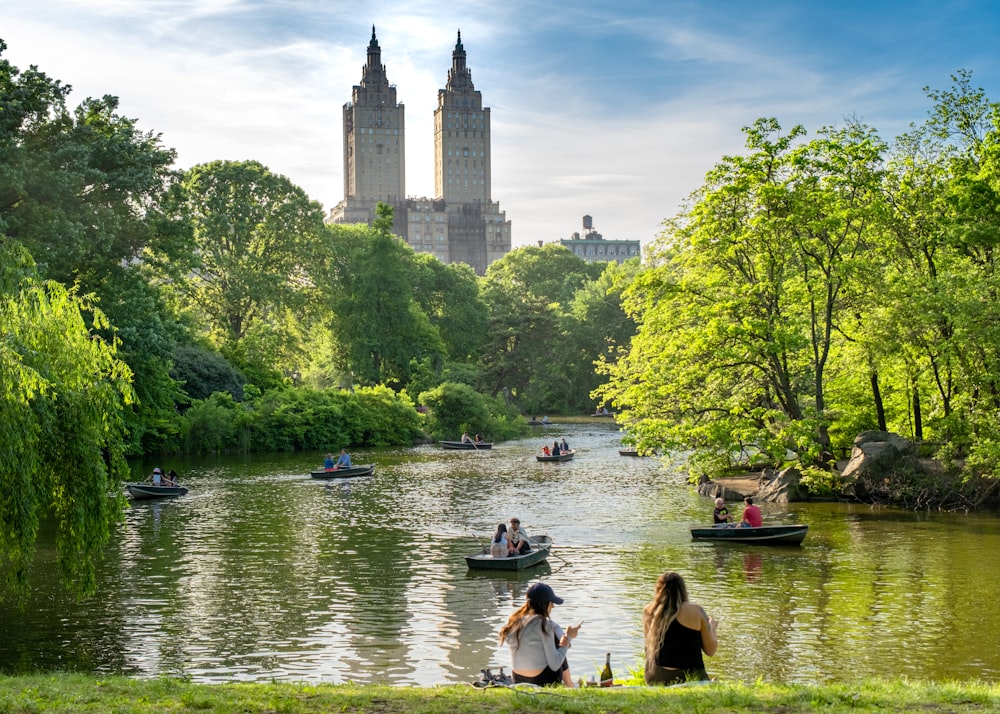 a group of people on small boats on a river