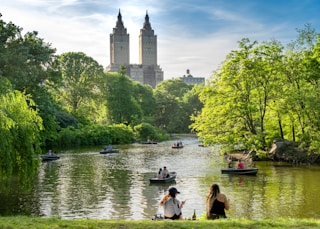 a group of people on small boats on a river