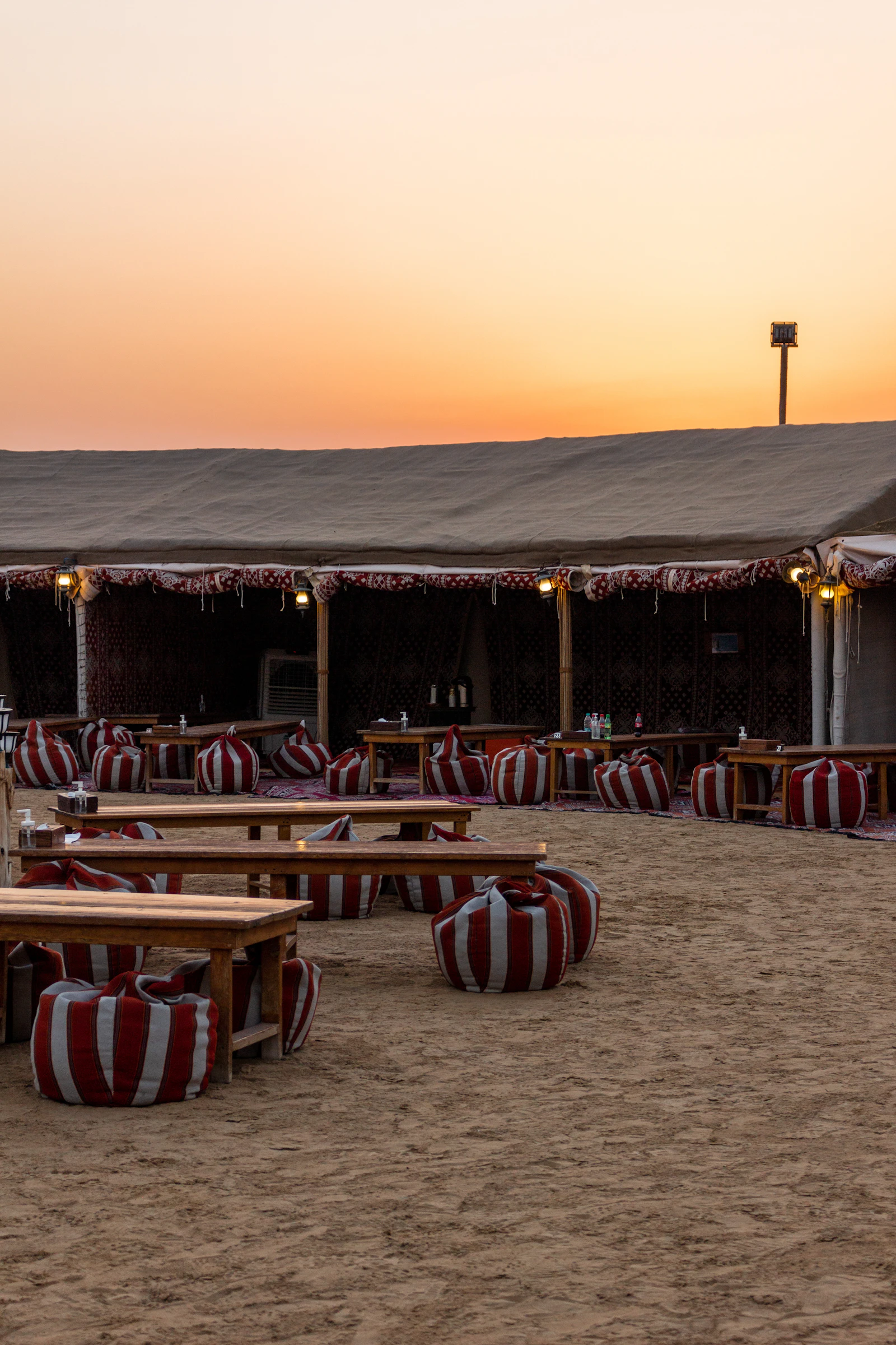 Traditional majlis seating with cushions at a Dubai desert camp