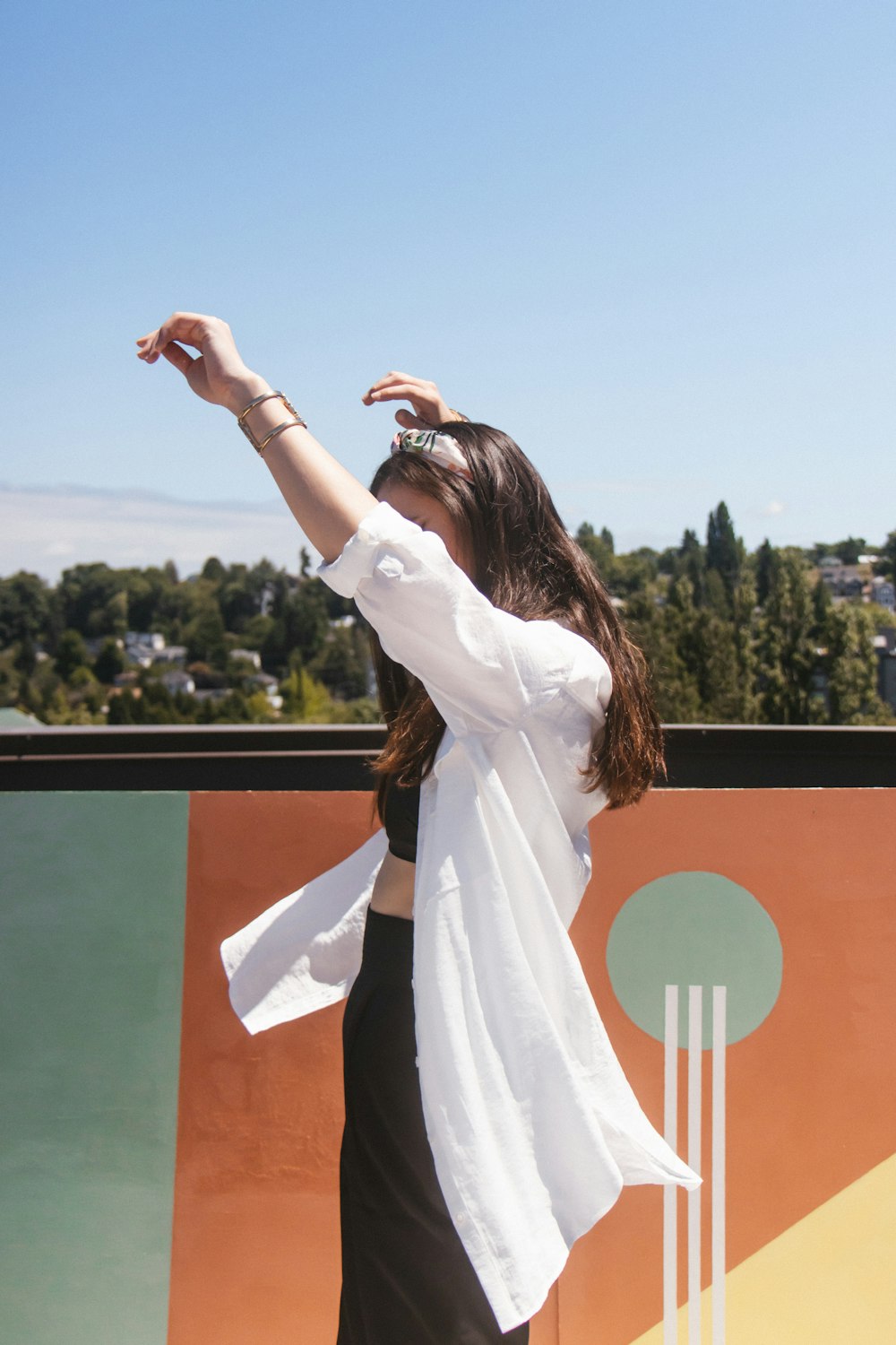 a woman standing on top of a tennis court holding a racquet