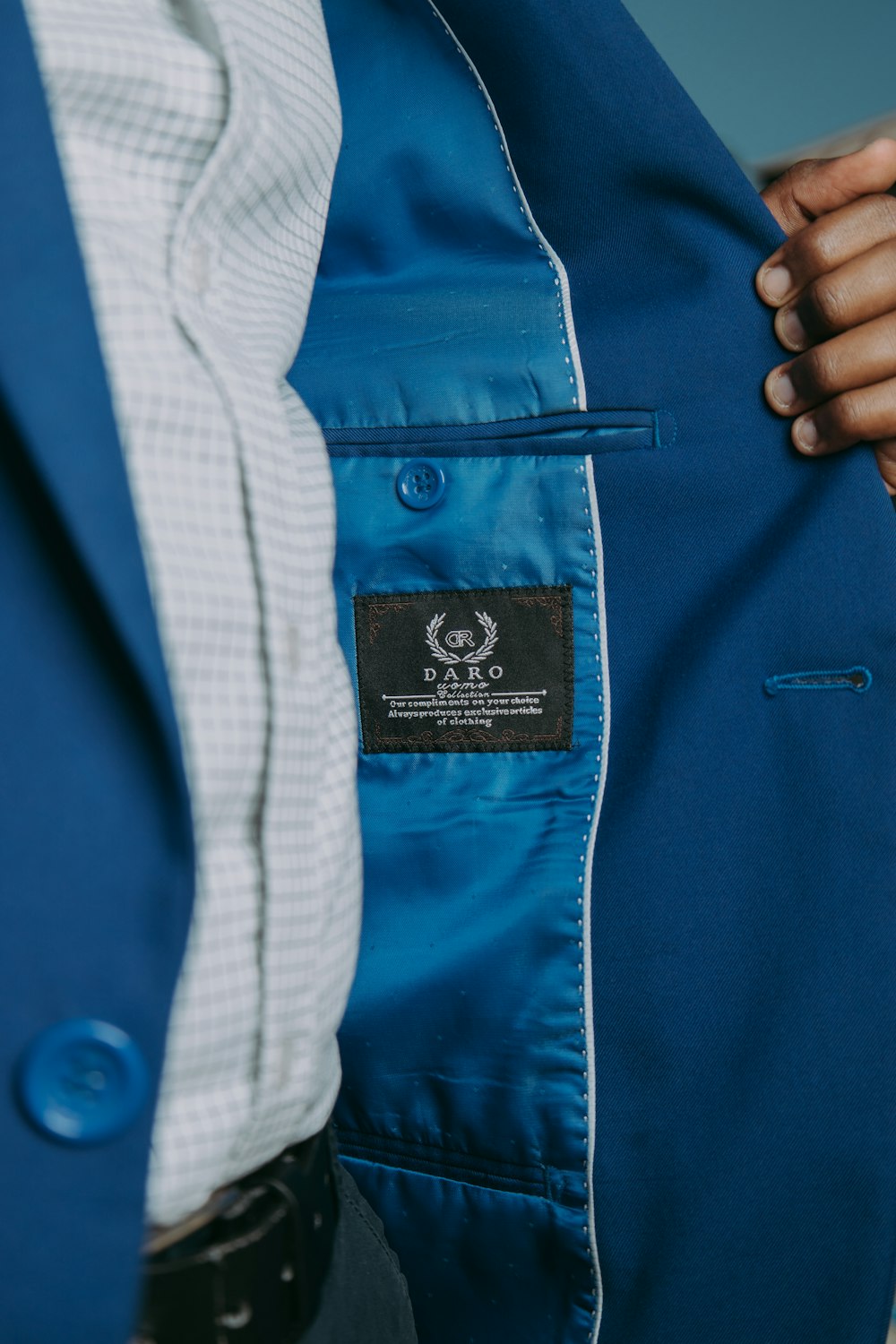 a close up of a person wearing a blue jacket