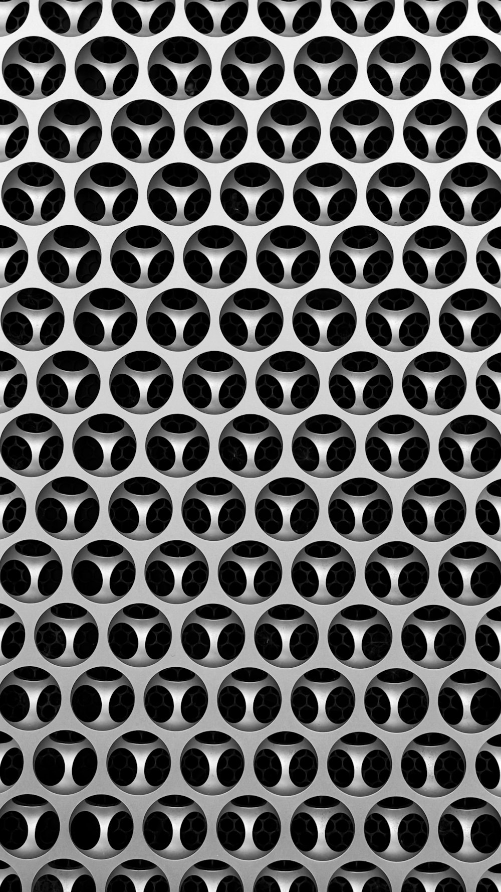 a black and white photo of a metal grate