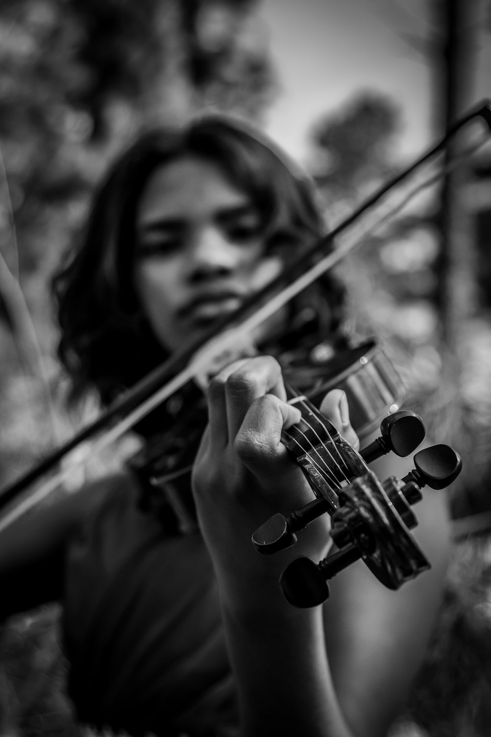 a woman holding a violin in her hands