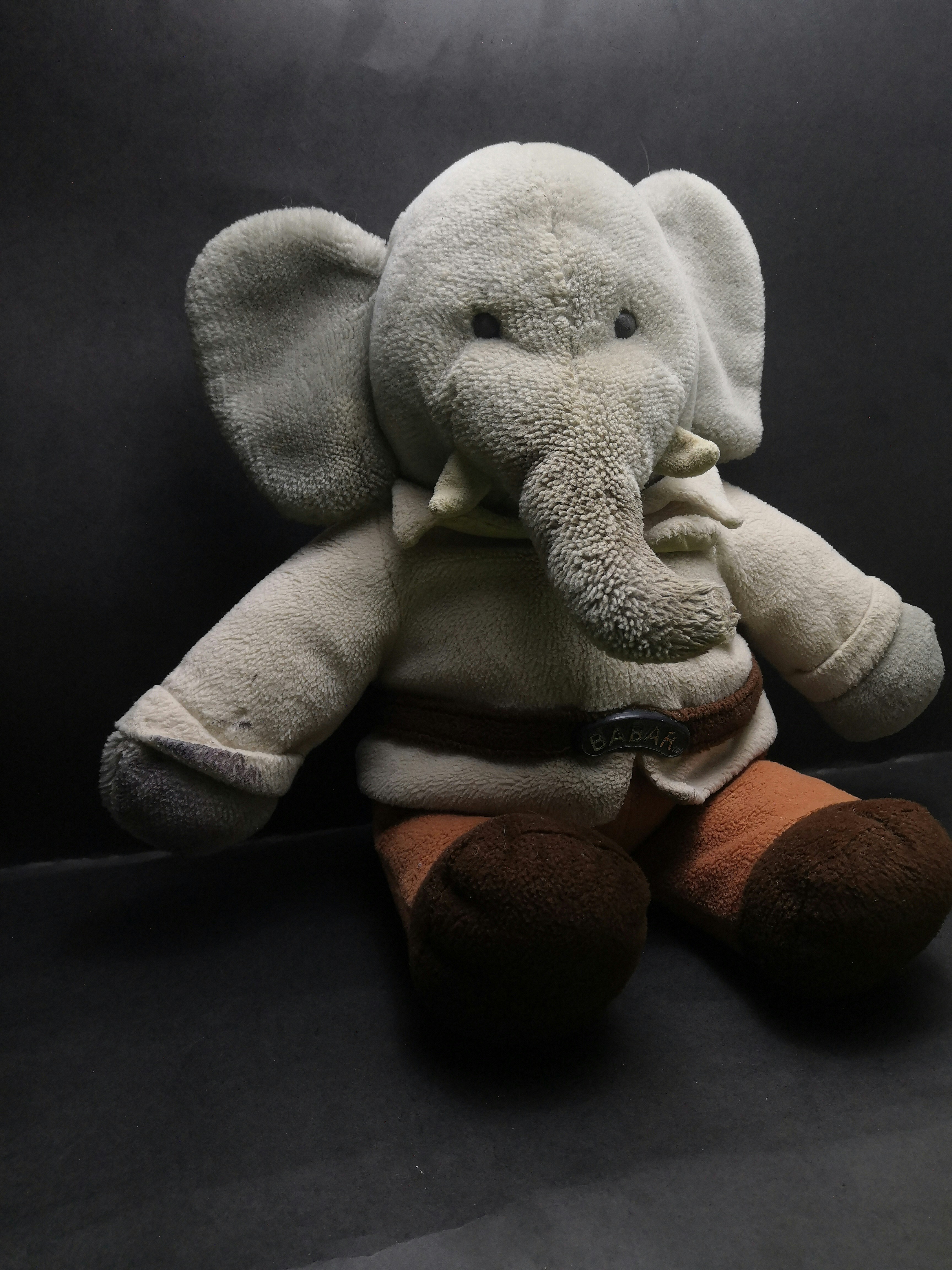 Colorful elephant plush toy with musical features for baby development