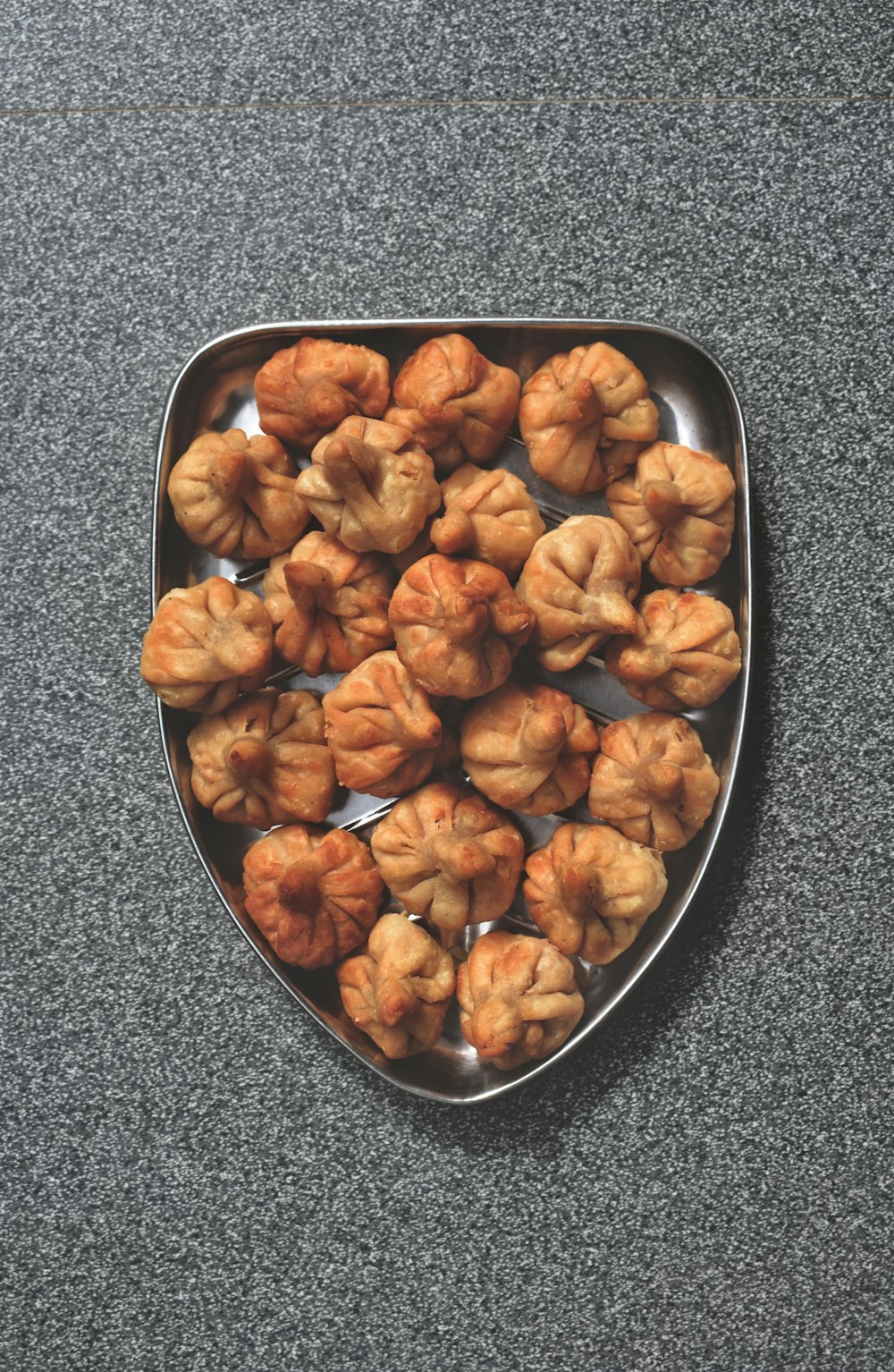 a metal tray filled with food on top of a table