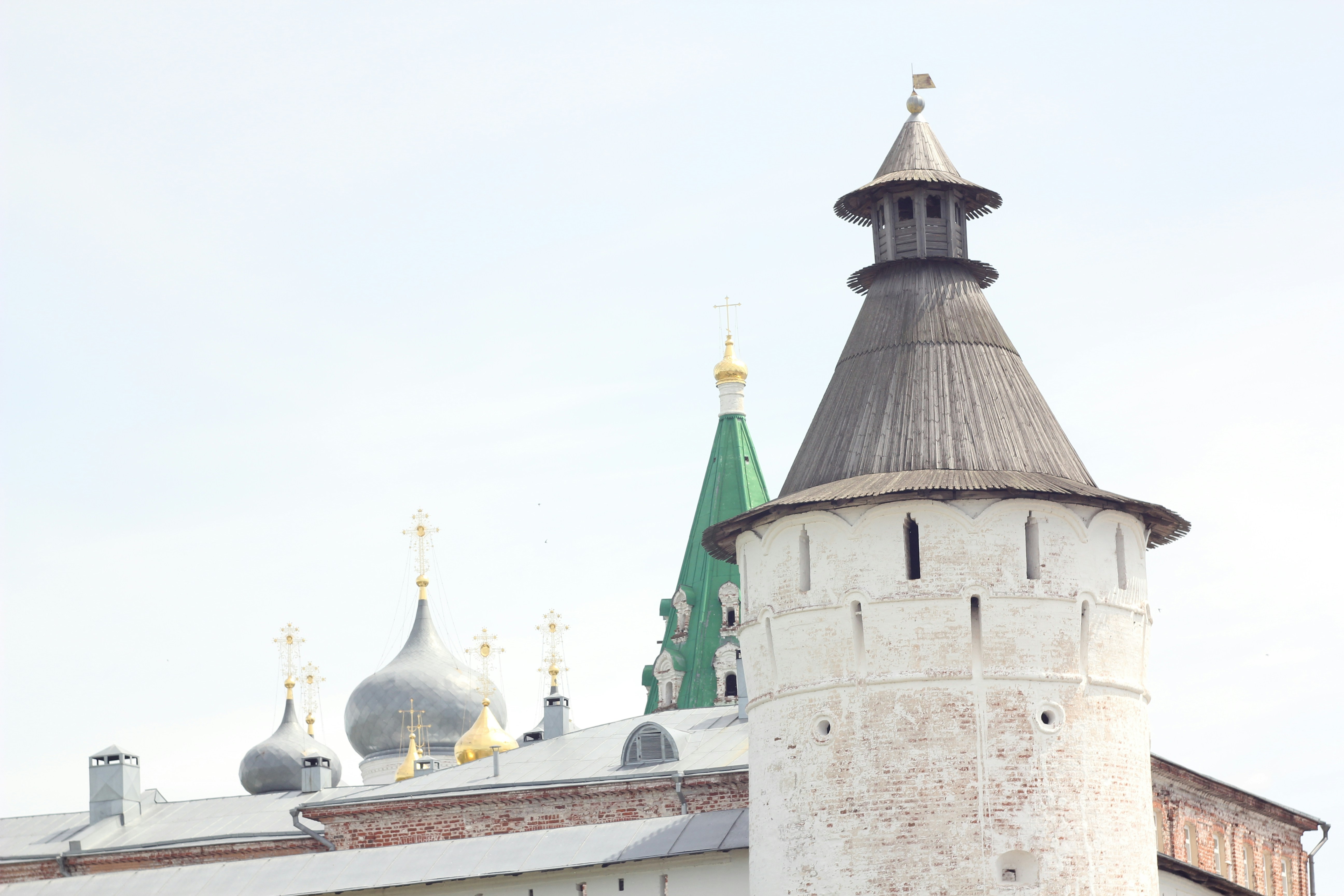 a tall white building with a green steeple