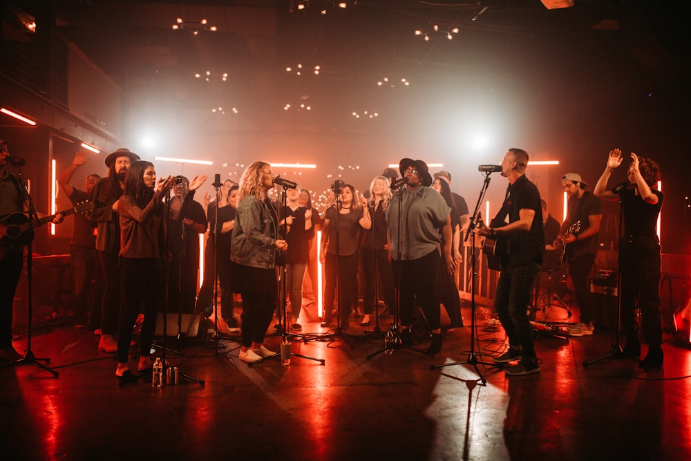 a group of people standing on top of a stage