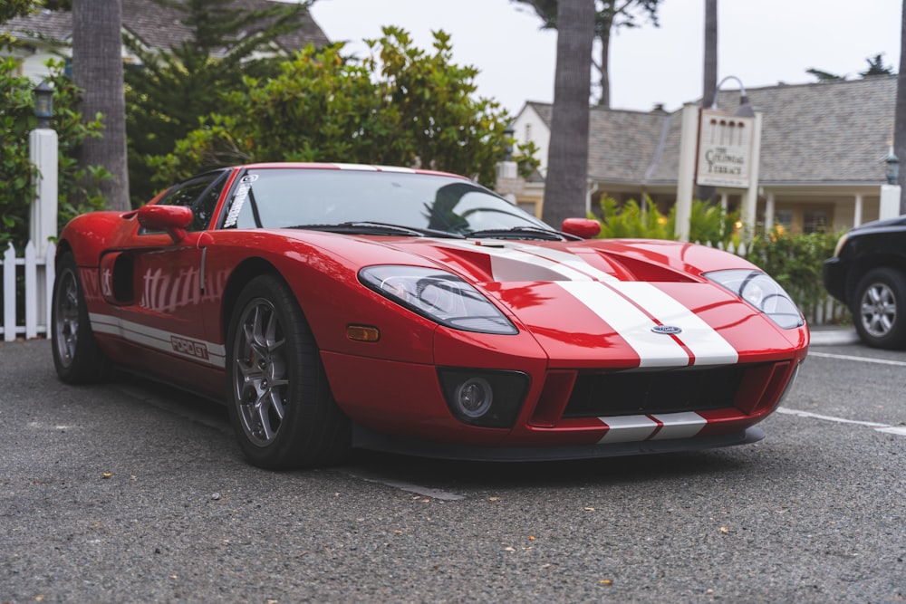 a red sports car parked in a parking lot